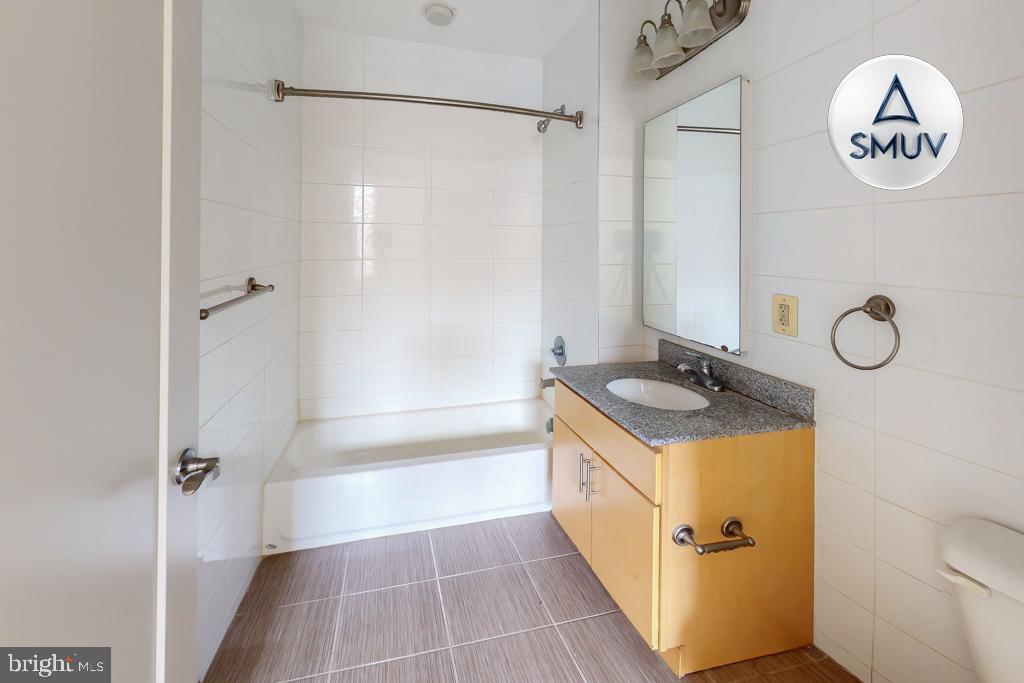 11 East Chase Street, Unit 506 Baltimore, MD 21202 - Photo 19 of 32 Modern bathroom with sleek finishes.