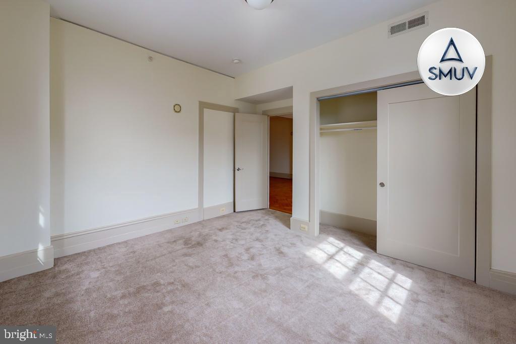 11 East Chase Street, Unit 506 Baltimore, MD 21202 - Photo 25 of 32 Spacious room with natural light and closet.