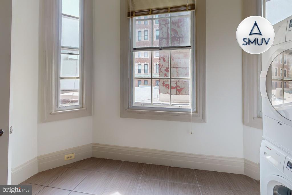 11 East Chase Street, Unit 506 Baltimore, MD 21202 - Photo 28 of 32 Bright corner laundry nook with ample light.