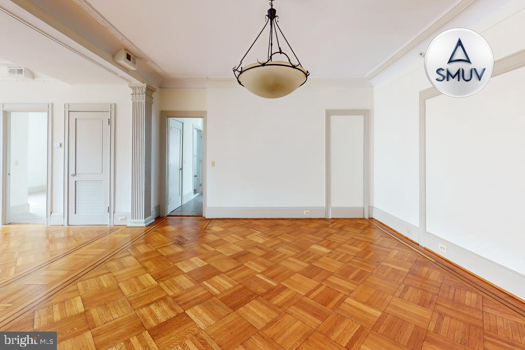 11 East Chase Street, Unit 506 Baltimore, MD 21202 - Photo 30 of 32 Spacious room with elegant parquet flooring.