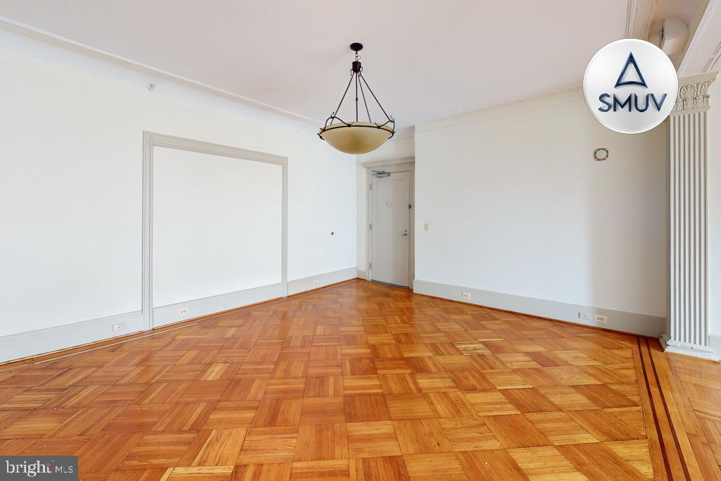 11 East Chase Street, Unit 506 Baltimore, MD 21202 - Photo 31 of 32 Spacious room with elegant parquet flooring.