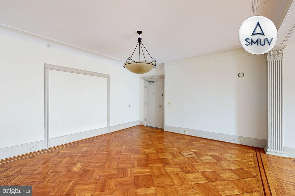 11 East Chase Street, Unit 506 Baltimore, MD 21202 - Photo 5 of 32 Spacious room with elegant parquet flooring.