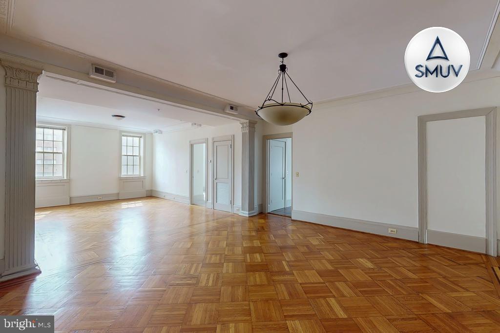 11 East Chase Street, Unit 506 Baltimore, MD 21202 - Photo 6 of 32 Spacious room with elegant hardwood floors.