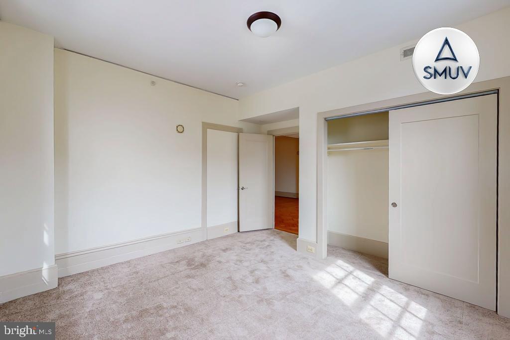 11 East Chase Street, Unit 506 Baltimore, MD 21202 - Photo 10 of 32 Spacious, light-filled room with closet.