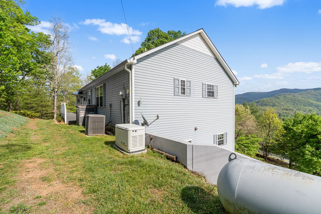 619 Pounding Mill Loop Hayesville, NC 28904 - Photo 13 of 54 a view of a backyard with garden