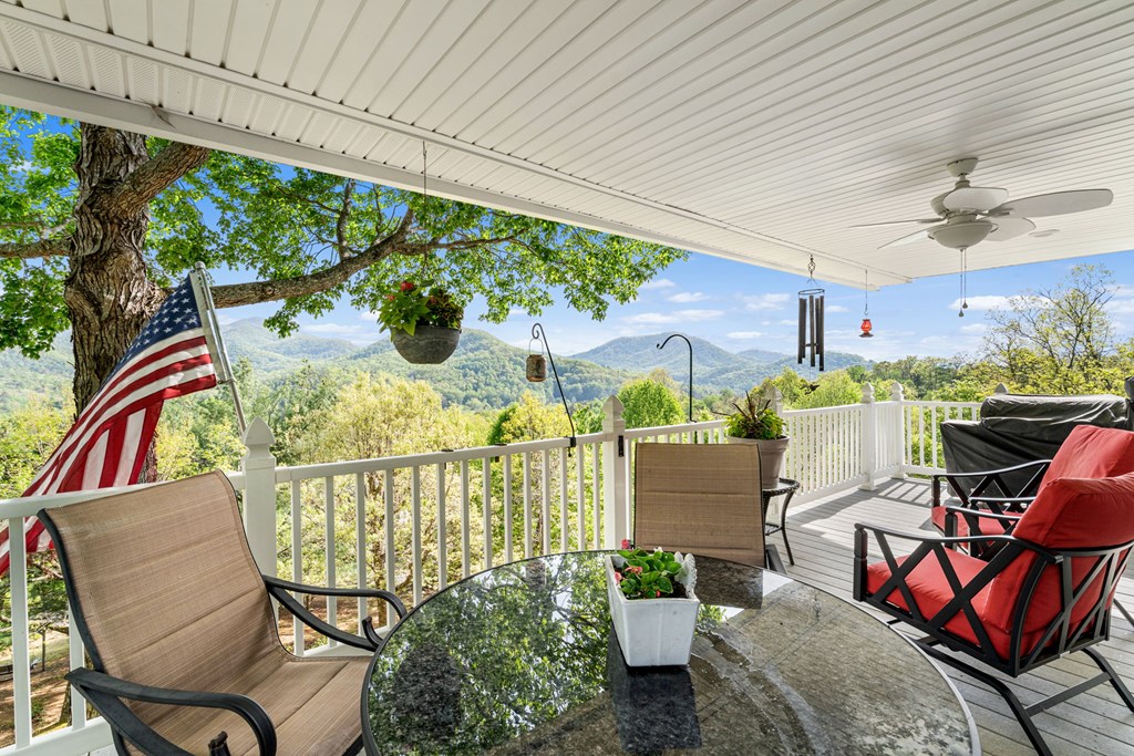 619 Pounding Mill Loop Hayesville, NC 28904 - Photo 28 of 54 a view of a chairs and table in patio