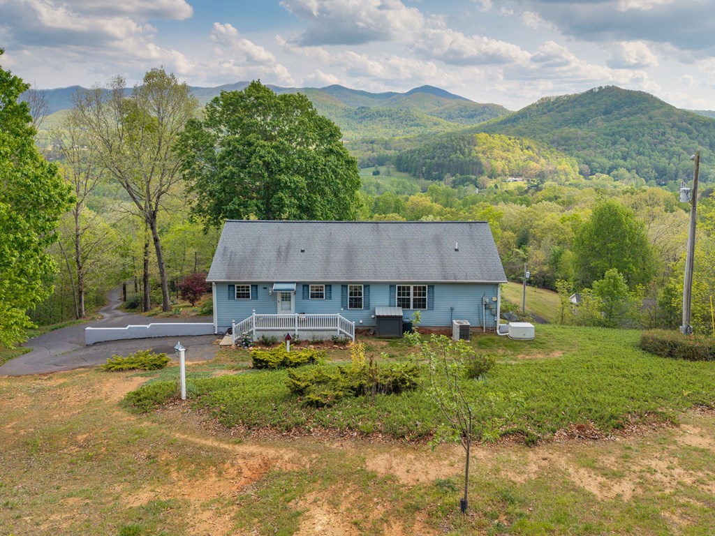 619 Pounding Mill Loop Hayesville, NC 28904 - Photo 3 of 54 a view of a house with a yard