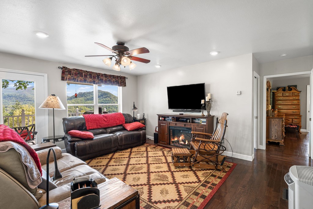 619 Pounding Mill Loop Hayesville, NC 28904 - Photo 32 of 54 a living room with furniture and a flat screen tv