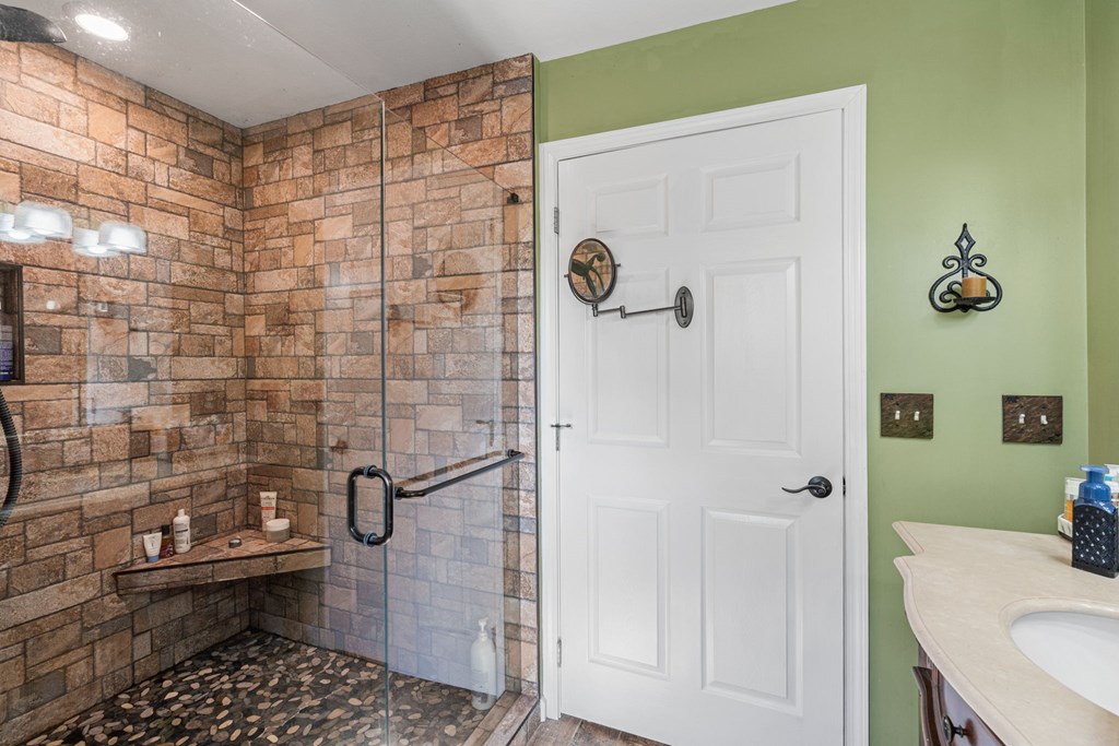 619 Pounding Mill Loop Hayesville, NC 28904 - Photo 37 of 54 a bathroom with a shower a toilet and a sink