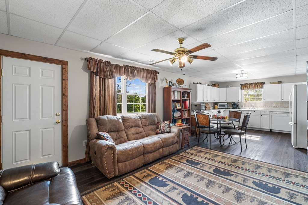 619 Pounding Mill Loop Hayesville, NC 28904 - Photo 46 of 54 a living room with furniture kitchen view and a chandelier