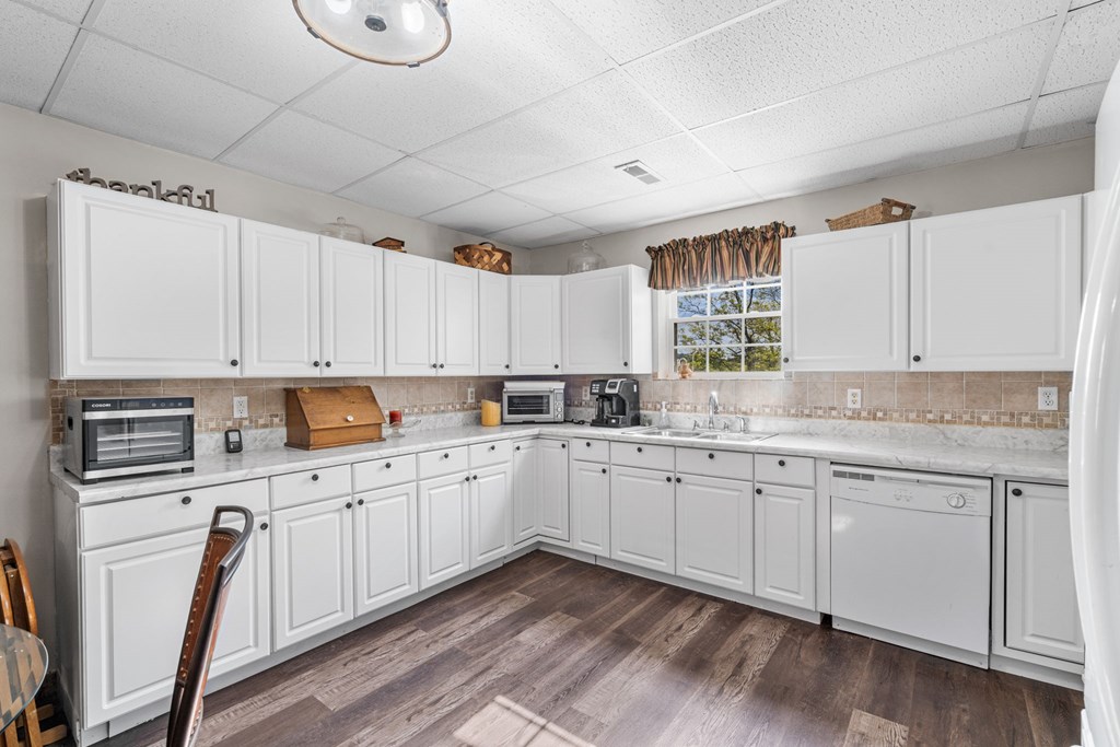 619 Pounding Mill Loop Hayesville, NC 28904 - Photo 49 of 54 a kitchen with cabinets appliances and a window