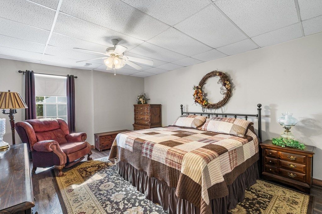 619 Pounding Mill Loop Hayesville, NC 28904 - Photo 51 of 54 a bedroom with bed and a chandelier