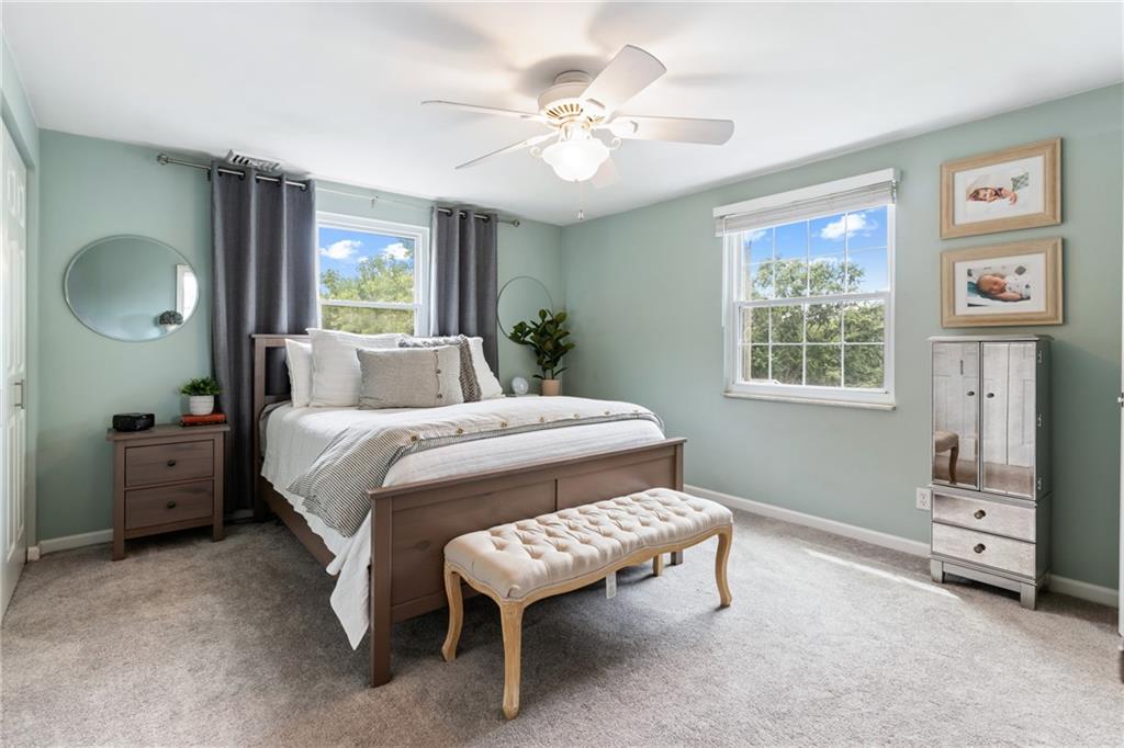 9342 Doral Drive Pittsburgh, PA 15237 - Photo 21 of 40 a bedroom with a bed and a chandelier