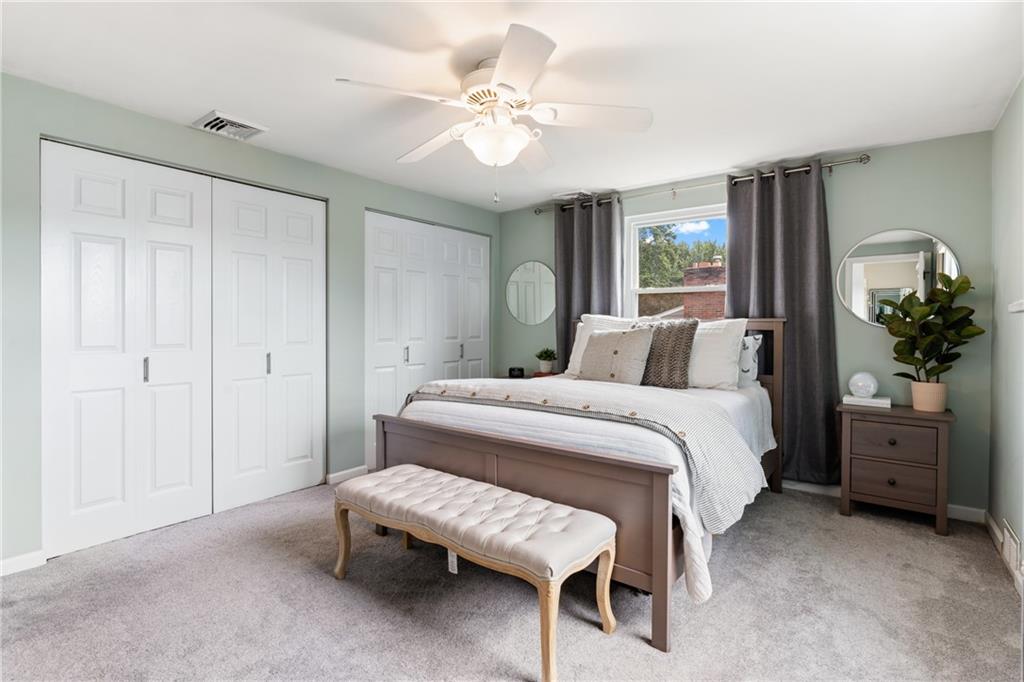 9342 Doral Drive Pittsburgh, PA 15237 - Photo 22 of 40 a bedroom with a bed and a chandelier