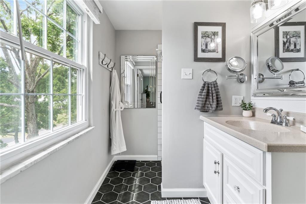 9342 Doral Drive Pittsburgh, PA 15237 - Photo 25 of 40 a bathroom with a sink and a mirror