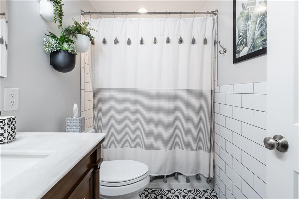 9342 Doral Drive Pittsburgh, PA 15237 - Photo 29 of 40 a bathroom with a sink toilet and shower