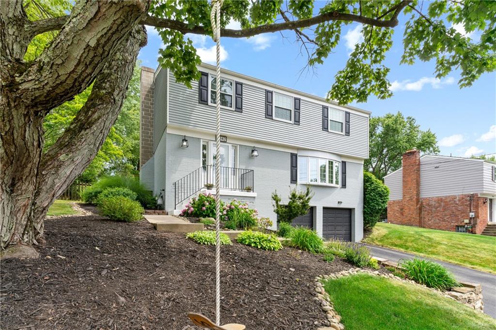 9342 Doral Drive Pittsburgh, PA 15237 - Photo 4 of 40 a front view of a house with a garden