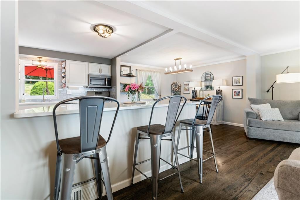 9342 Doral Drive Pittsburgh, PA 15237 - Photo 8 of 40 a view of a dining room with furniture and wooden floor