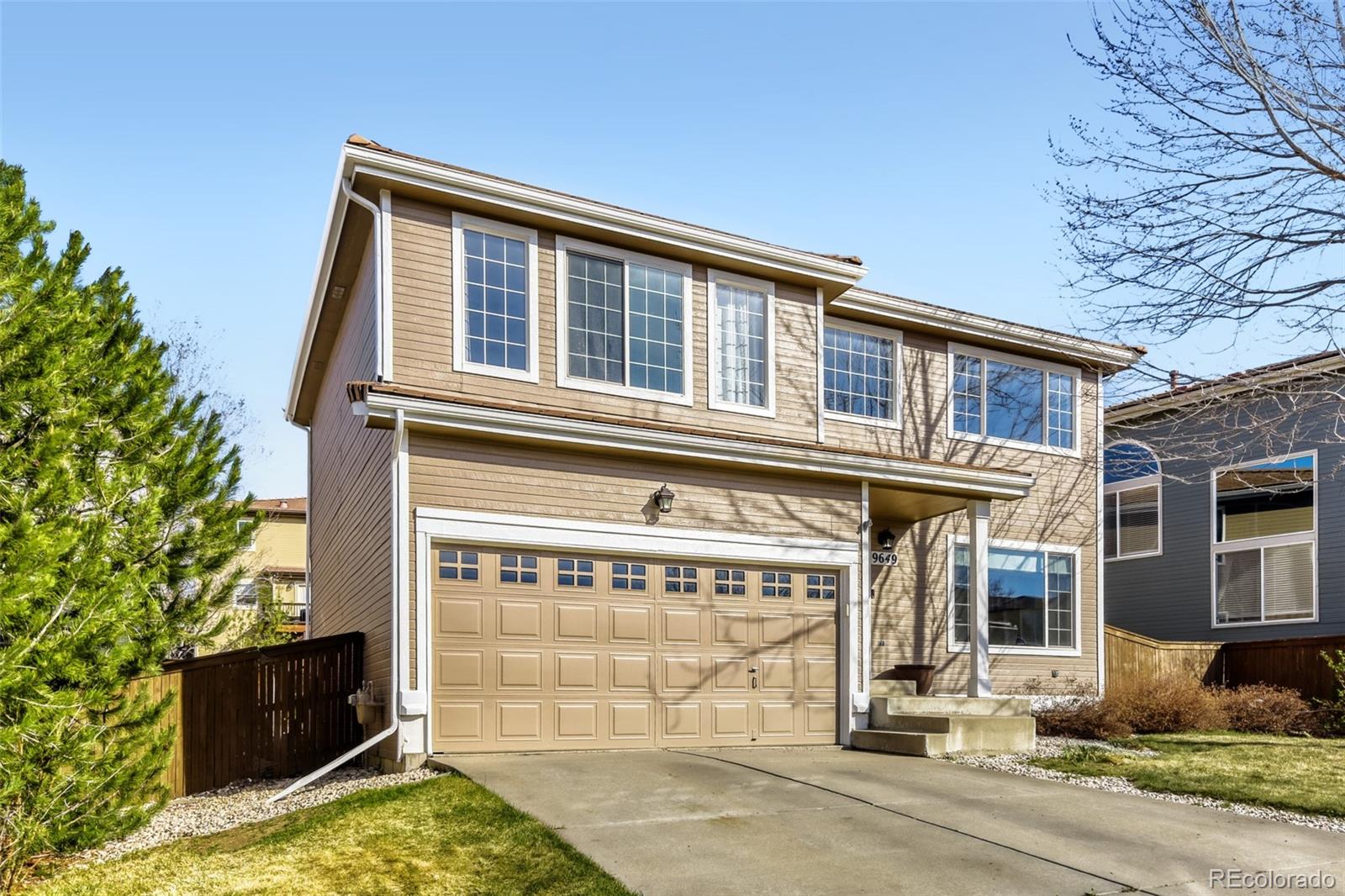 9649 Adelaide Circle Highlands Ranch, CO 80130 - Photo 2 of 32 front view of a building