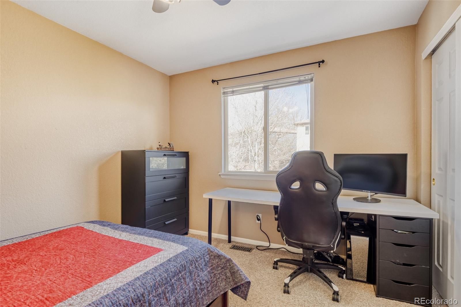 9649 Adelaide Circle Highlands Ranch, CO 80130 - Photo 22 of 32 a bedroom with a workspace