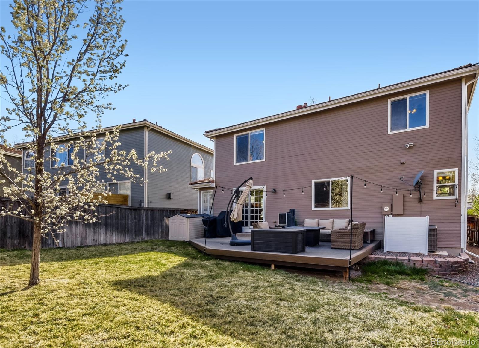 9649 Adelaide Circle Highlands Ranch, CO 80130 - Photo 26 of 32 a house view with a outdoor seating space