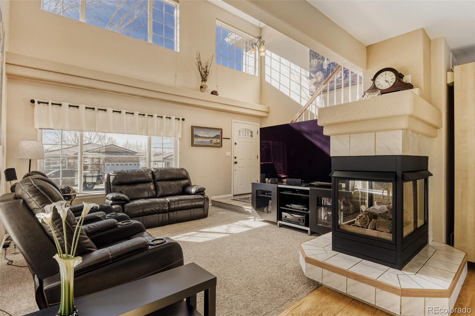 9649 Adelaide Circle Highlands Ranch, CO 80130 - Photo 4 of 32 a living room with furniture and a flat screen tv
