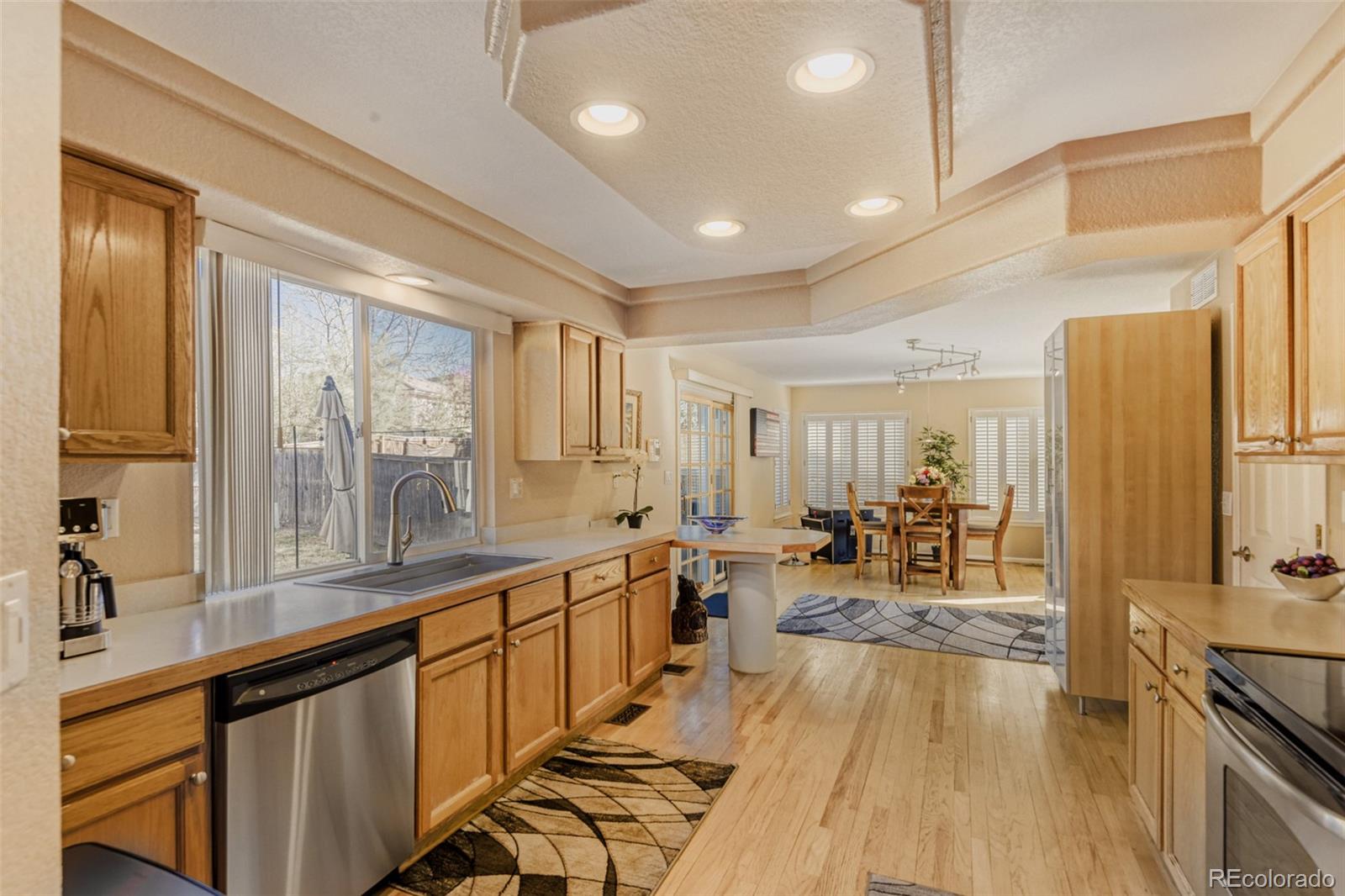 9649 Adelaide Circle Highlands Ranch, CO 80130 - Photo 8 of 32 a very nice looking living room with a large window and furniture
