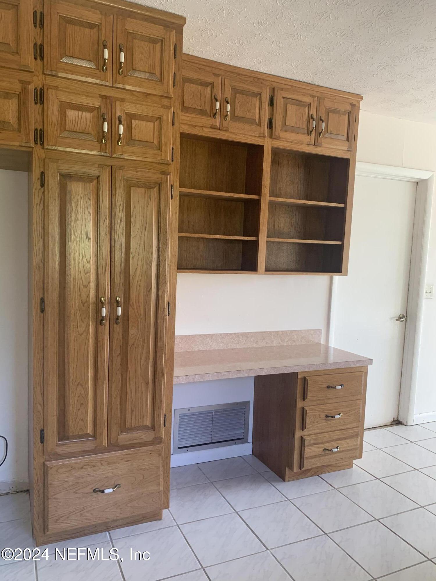 10558 Tulsa Road Jacksonville, FL 32218 - Photo 15 of 24 a view of a dresser