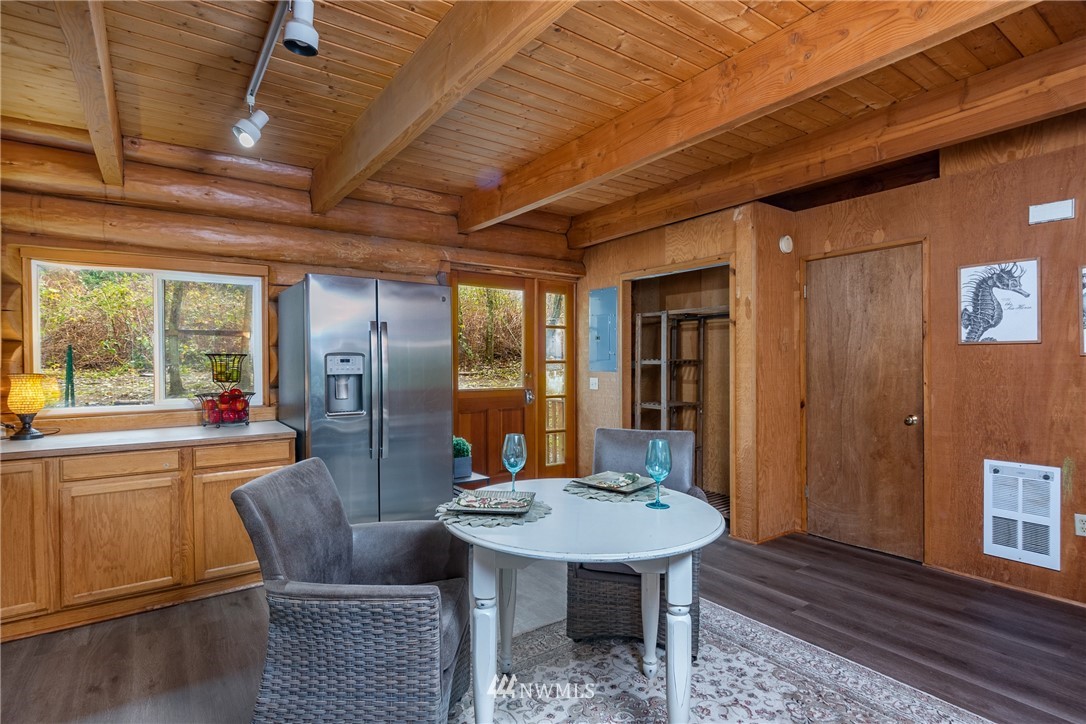 5720 Cameron Road Freeland, WA 98249 - Photo 14 of 36 a view of a dining room with furniture window and wooden floor