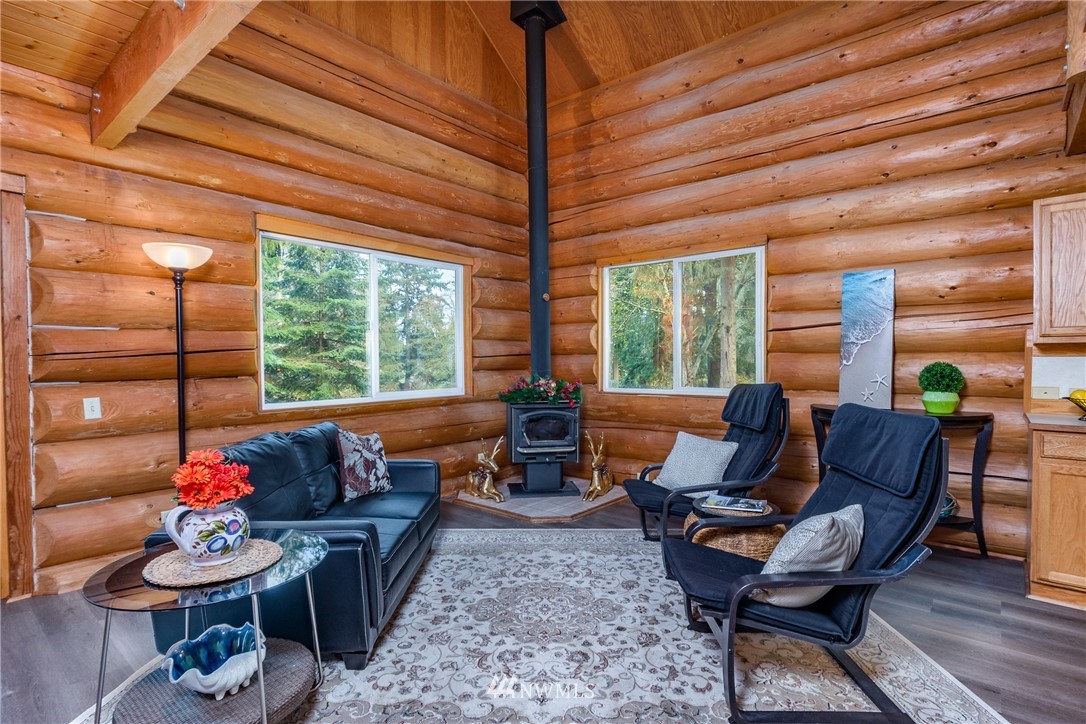 5720 Cameron Road Freeland, WA 98249 - Photo 15 of 36 a living room with furniture and a large window