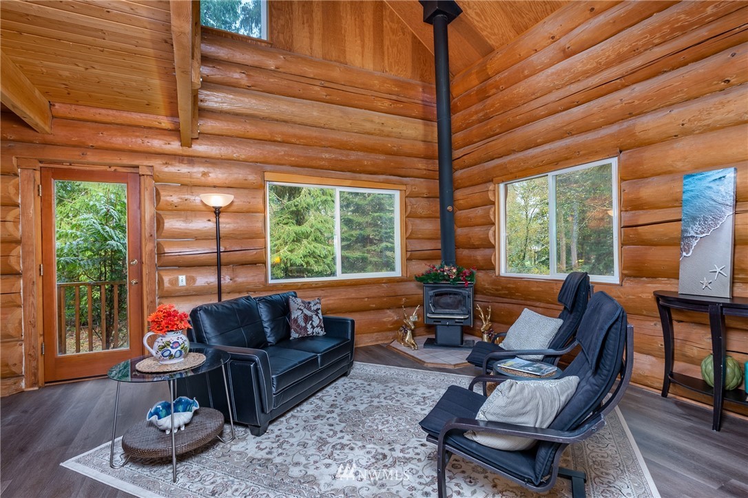 5720 Cameron Road Freeland, WA 98249 - Photo 16 of 36 a living room with furniture and a large window