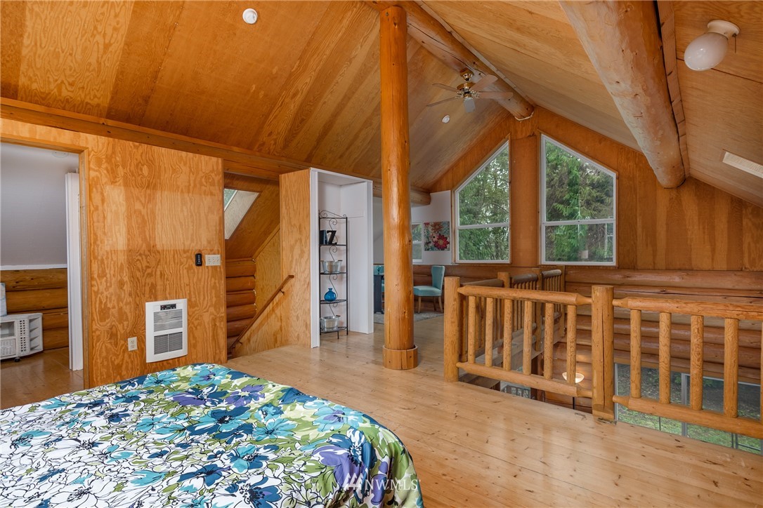 5720 Cameron Road Freeland, WA 98249 - Photo 26 of 36 a bedroom with furniture and a window