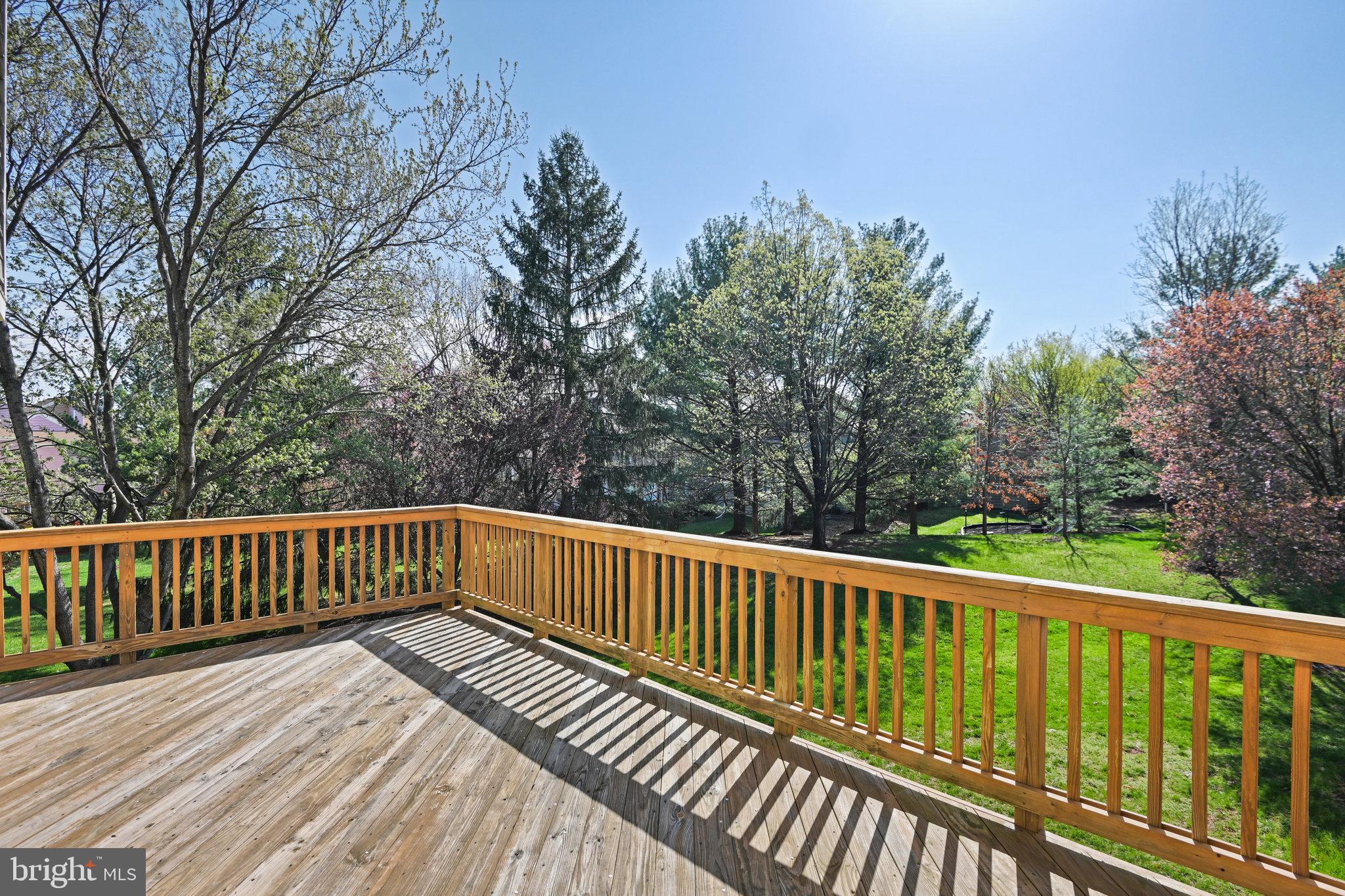21174 Wildflower Square Ashburn, VA 20147 - Photo 13 of 30 a view of balcony with wooden floor and fence