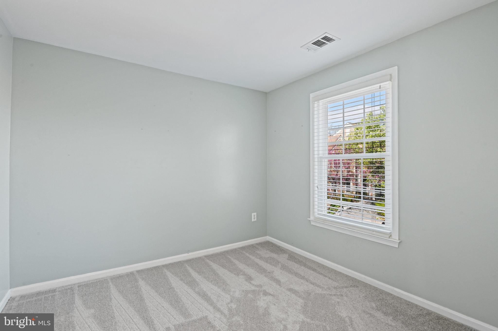 21174 Wildflower Square Ashburn, VA 20147 - Photo 14 of 30 a view of an empty room with a window