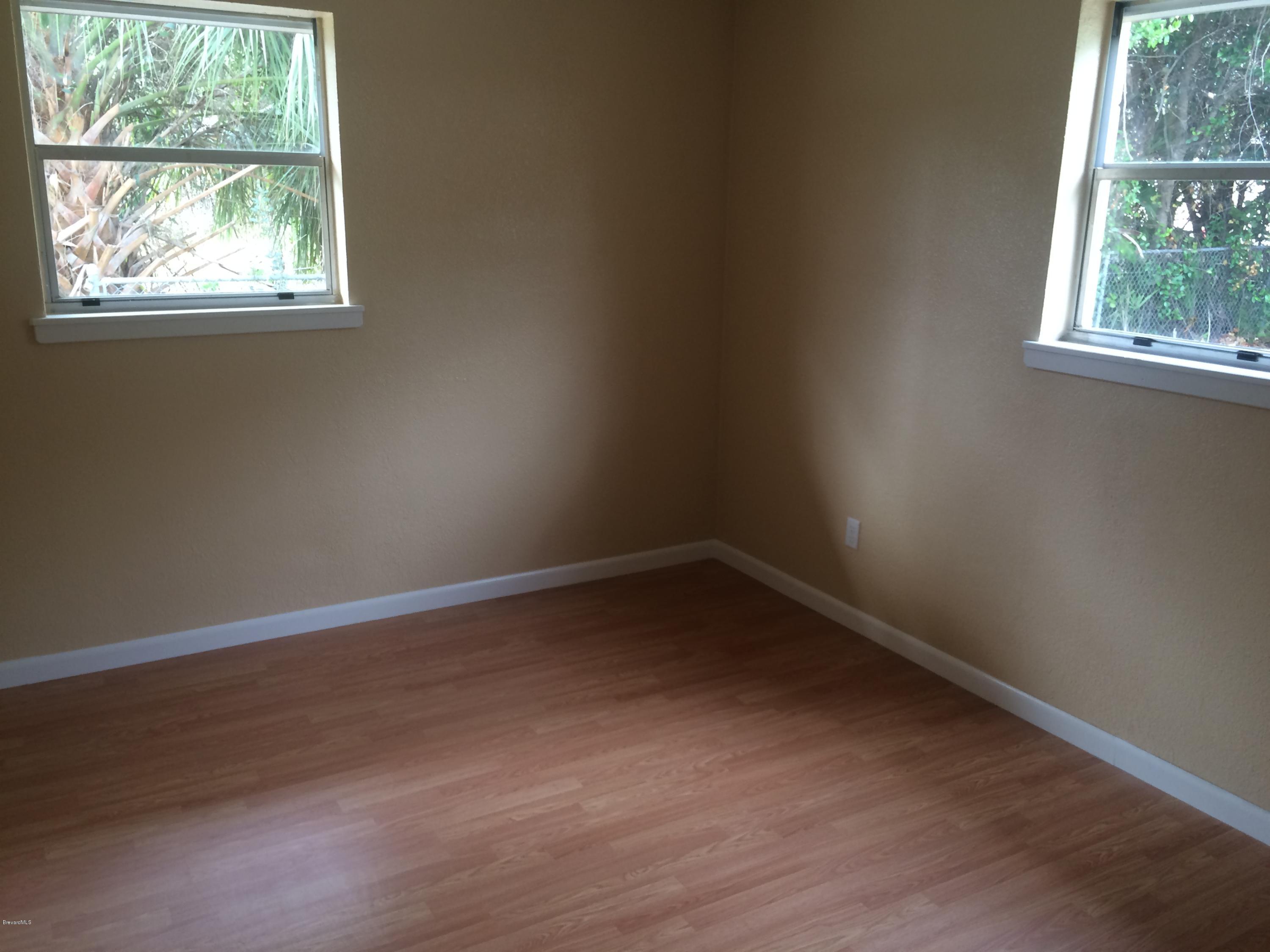1040 Hickory Lane Cocoa, FL 32922 - Photo 15 of 17 an empty room with a window