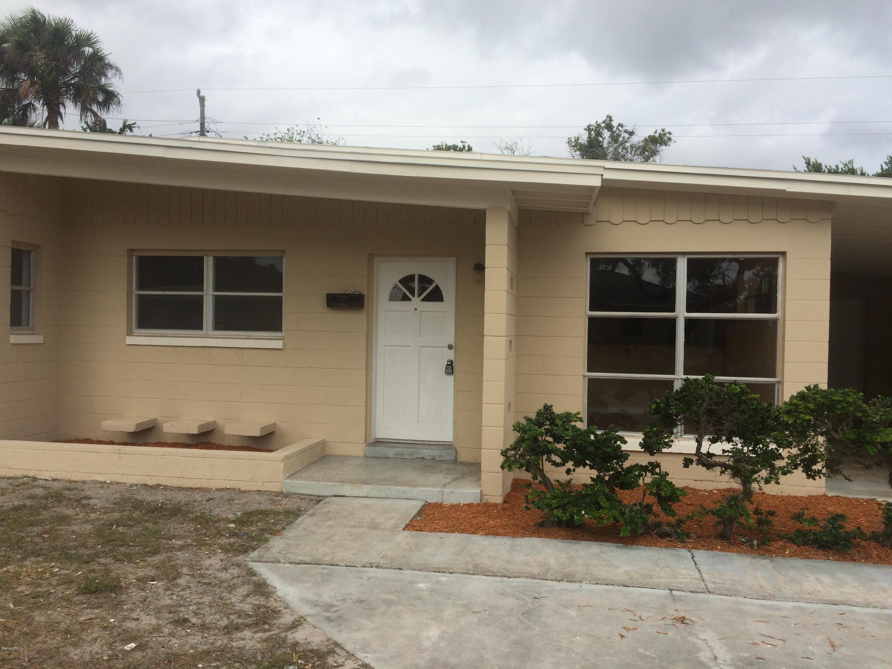 1040 Hickory Lane Cocoa, FL 32922 - Photo 3 of 17 a front view of a house