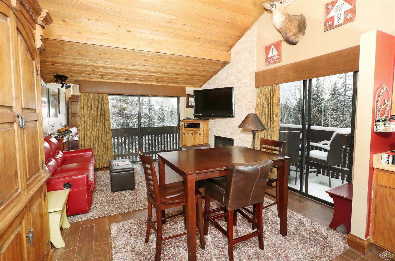 442 South Frontage Road East, Unit B306 Vail, CO 81657 - Photo 1 of 18 a view of a dining room with furniture window and outside view