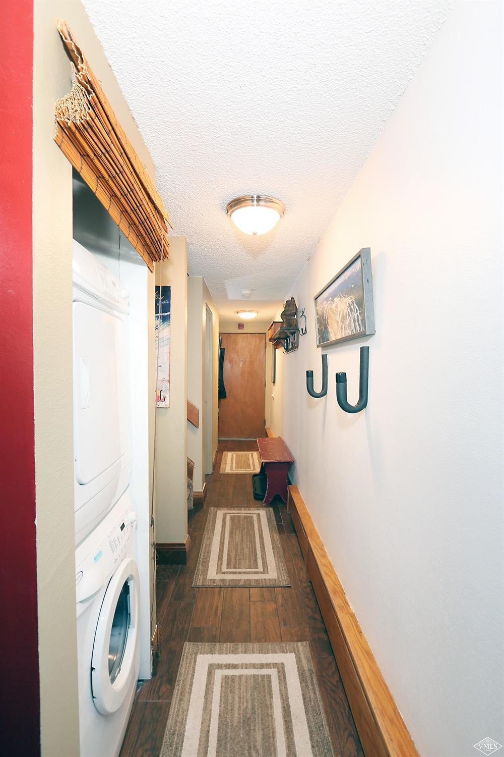 442 South Frontage Road East, Unit B306 Vail, CO 81657 - Photo 13 of 18 a view of a hallway with washer and dryer