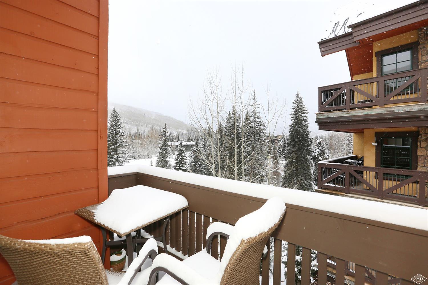 442 South Frontage Road East, Unit B306 Vail, CO 81657 - Photo 18 of 18 a view of a balcony with table and chairs