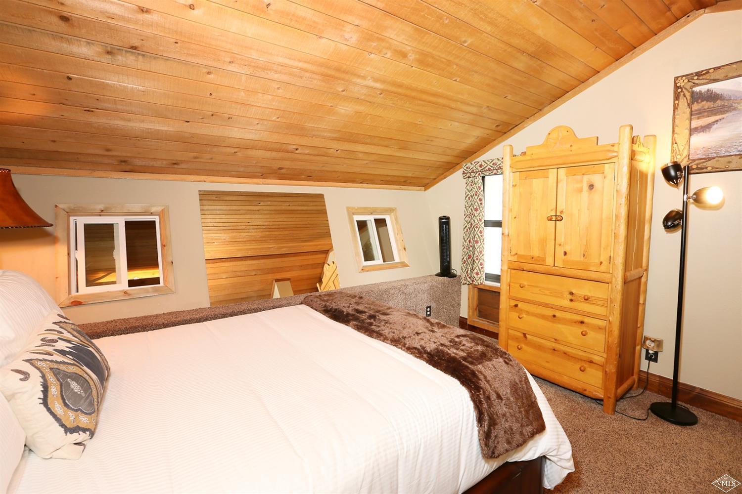 442 South Frontage Road East, Unit B306 Vail, CO 81657 - Photo 10 of 18 a bedroom with a bed and a cabinets