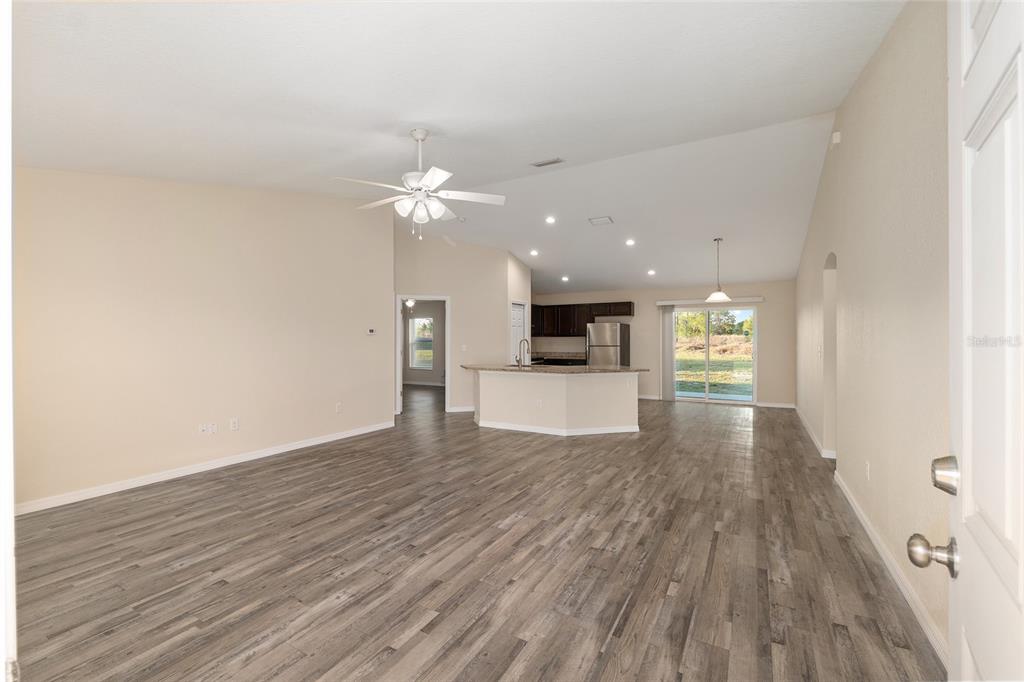 71 Juniper Trail Loop Ocala, FL 34480 - Photo 12 of 58 a view of kitchen with cabinets and wooden floor