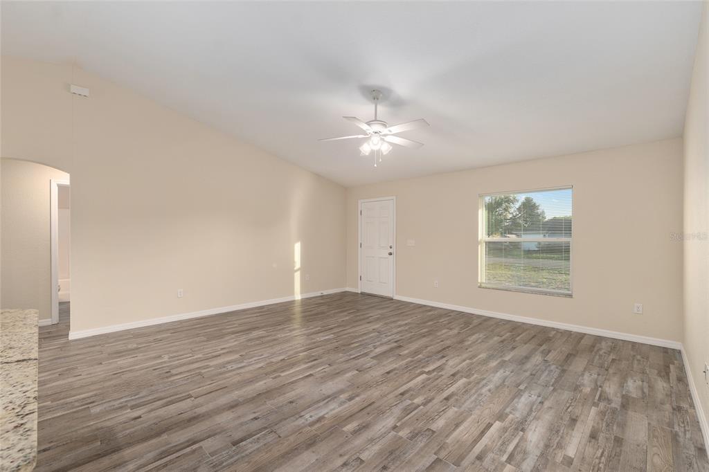 71 Juniper Trail Loop Ocala, FL 34480 - Photo 15 of 58 wooden floor in an empty room with a window