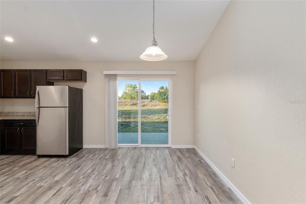 71 Juniper Trail Loop Ocala, FL 34480 - Photo 19 of 58 a view of empty room with wooden floor and window