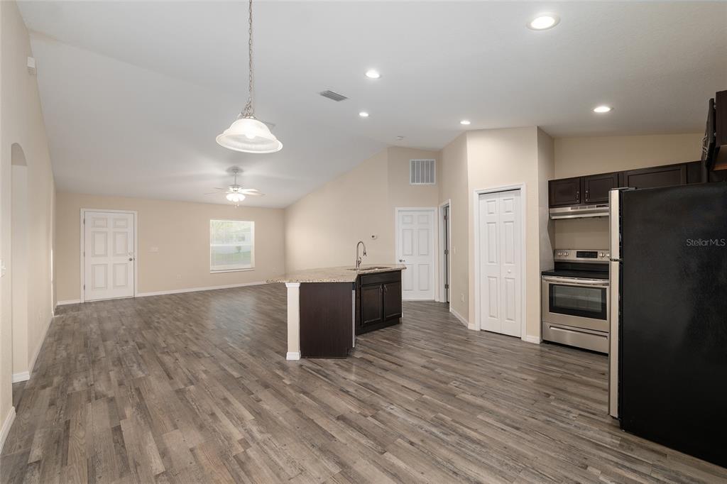 71 Juniper Trail Loop Ocala, FL 34480 - Photo 21 of 58 a view of kitchen with sink microwave and refrigerator