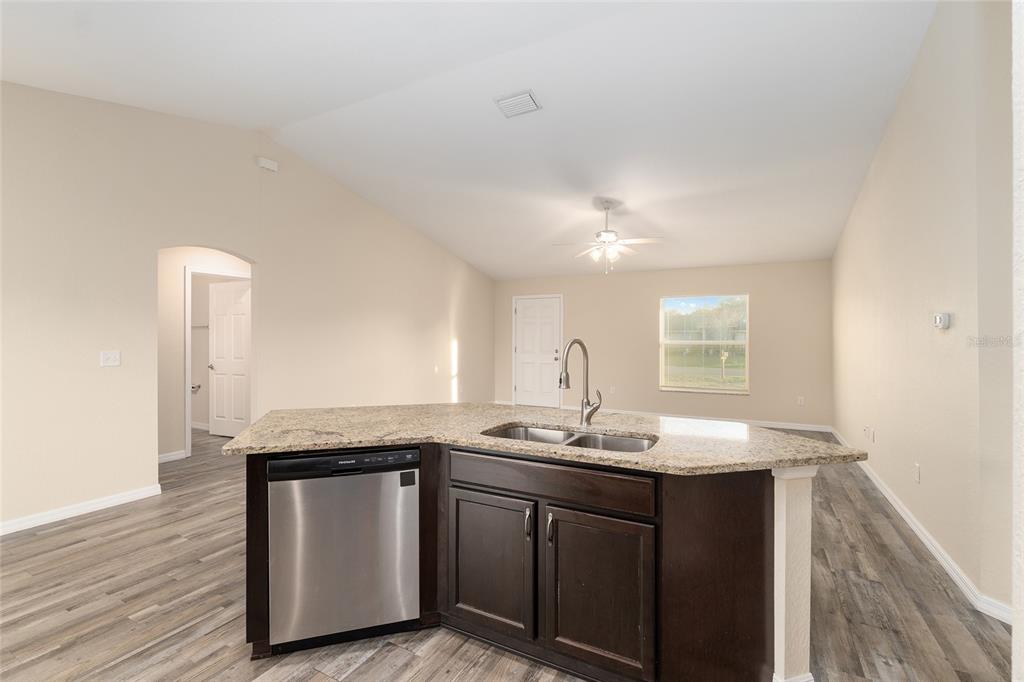71 Juniper Trail Loop Ocala, FL 34480 - Photo 26 of 58 a bathroom with a granite countertop sink and a mirror