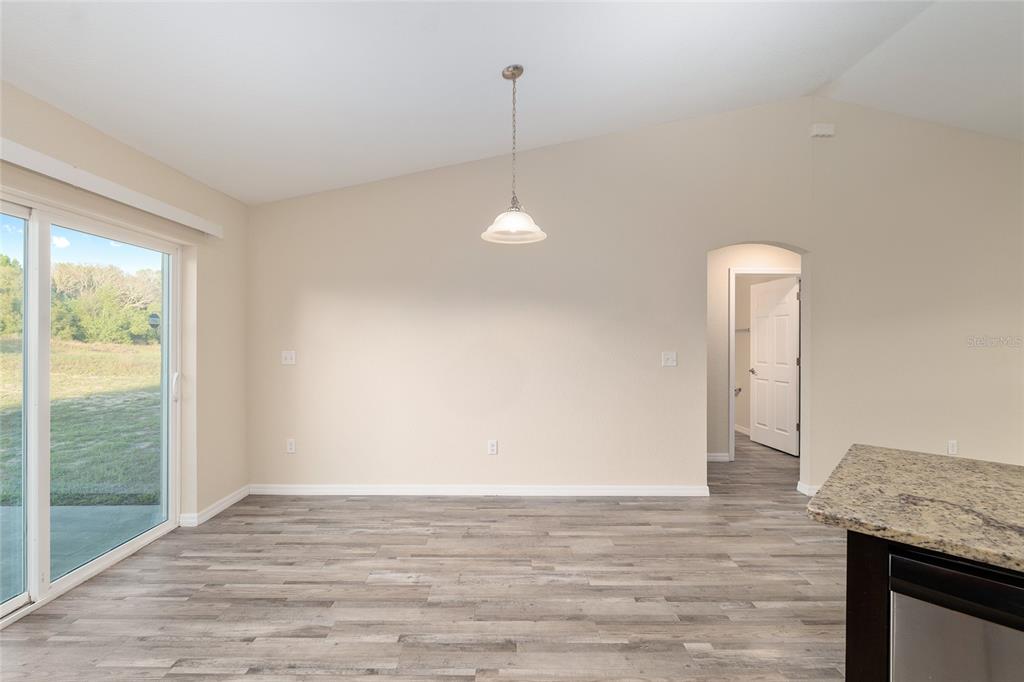 71 Juniper Trail Loop Ocala, FL 34480 - Photo 31 of 58 a view of a room with wooden floor and windows