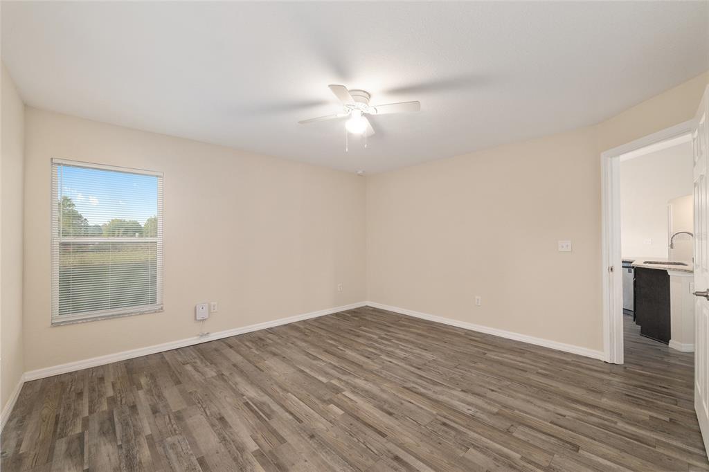 71 Juniper Trail Loop Ocala, FL 34480 - Photo 34 of 58 a view of empty room with wooden floor and fan