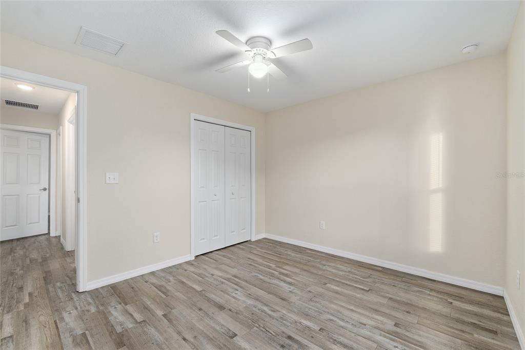71 Juniper Trail Loop Ocala, FL 34480 - Photo 44 of 58 a view of an empty room with wooden floor