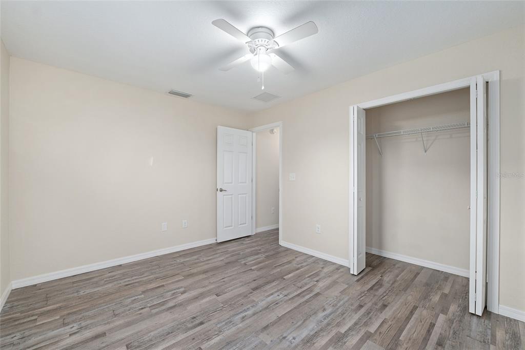 71 Juniper Trail Loop Ocala, FL 34480 - Photo 45 of 58 a view of an empty room with wooden floor