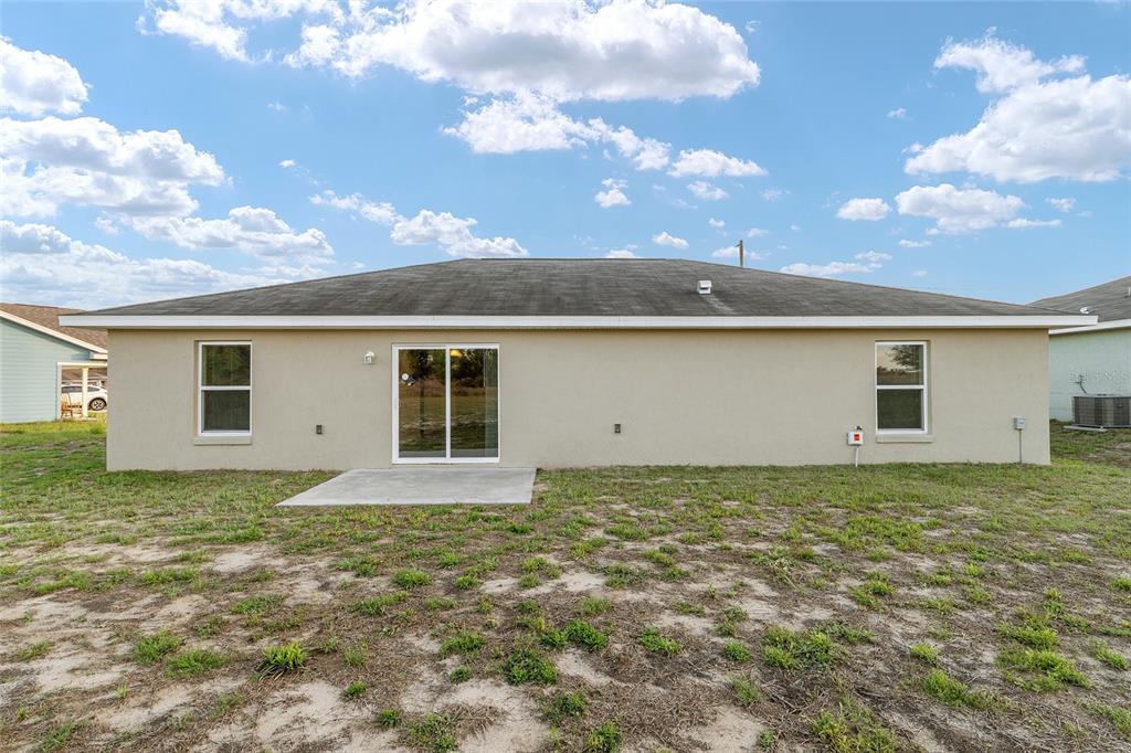 71 Juniper Trail Loop Ocala, FL 34480 - Photo 48 of 58 a view of a house with a yard
